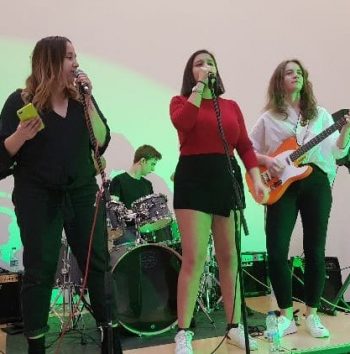 group of teenagers performing in a band