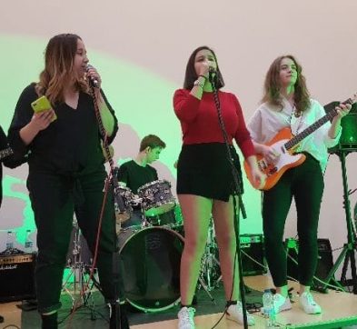group of teenagers performing in a band
