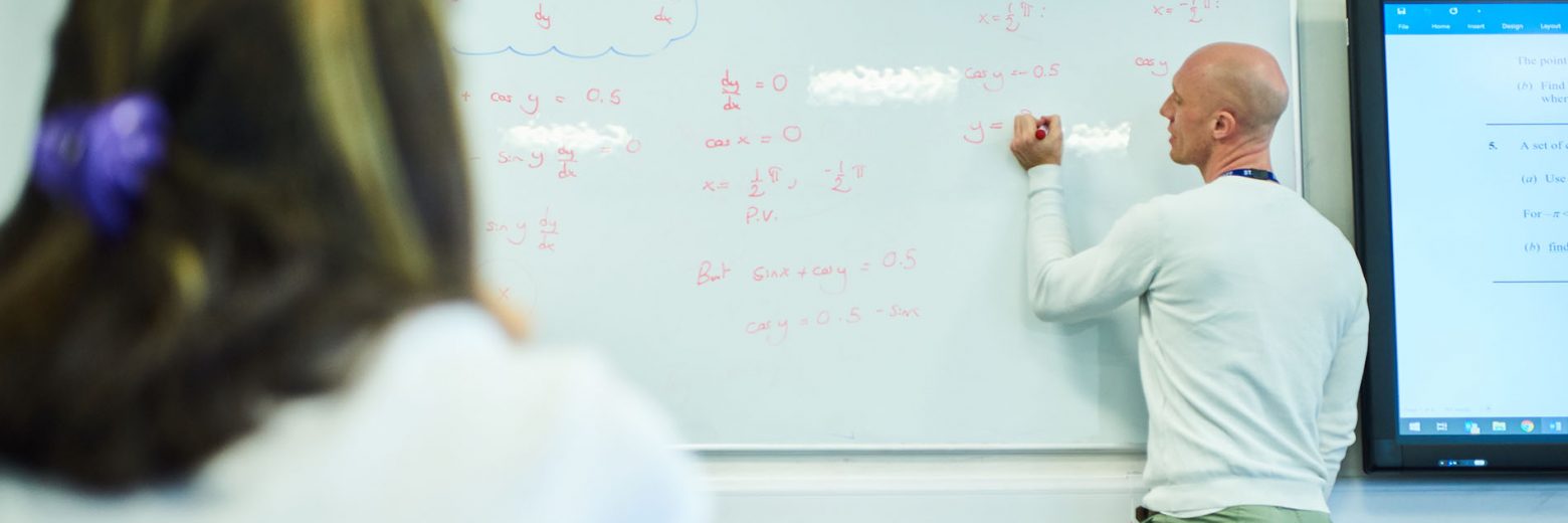 Student and teacher in mathematics class