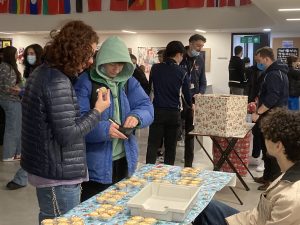 Students buying cupcakes