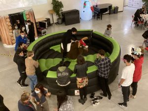 Students playing on a riding bull