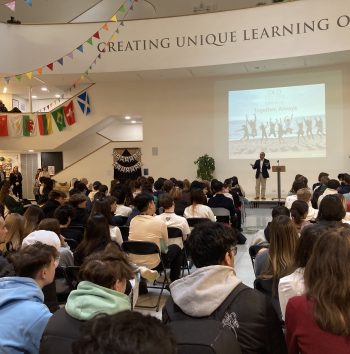 students listening to the Head at the end of term assembly