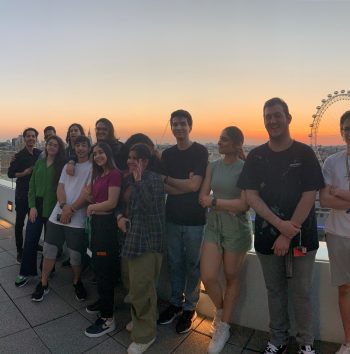 students watching sunset from a roof