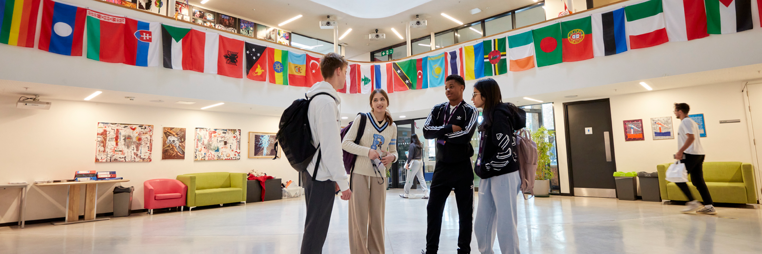 DLD College London Students Chatting In The School Atrium